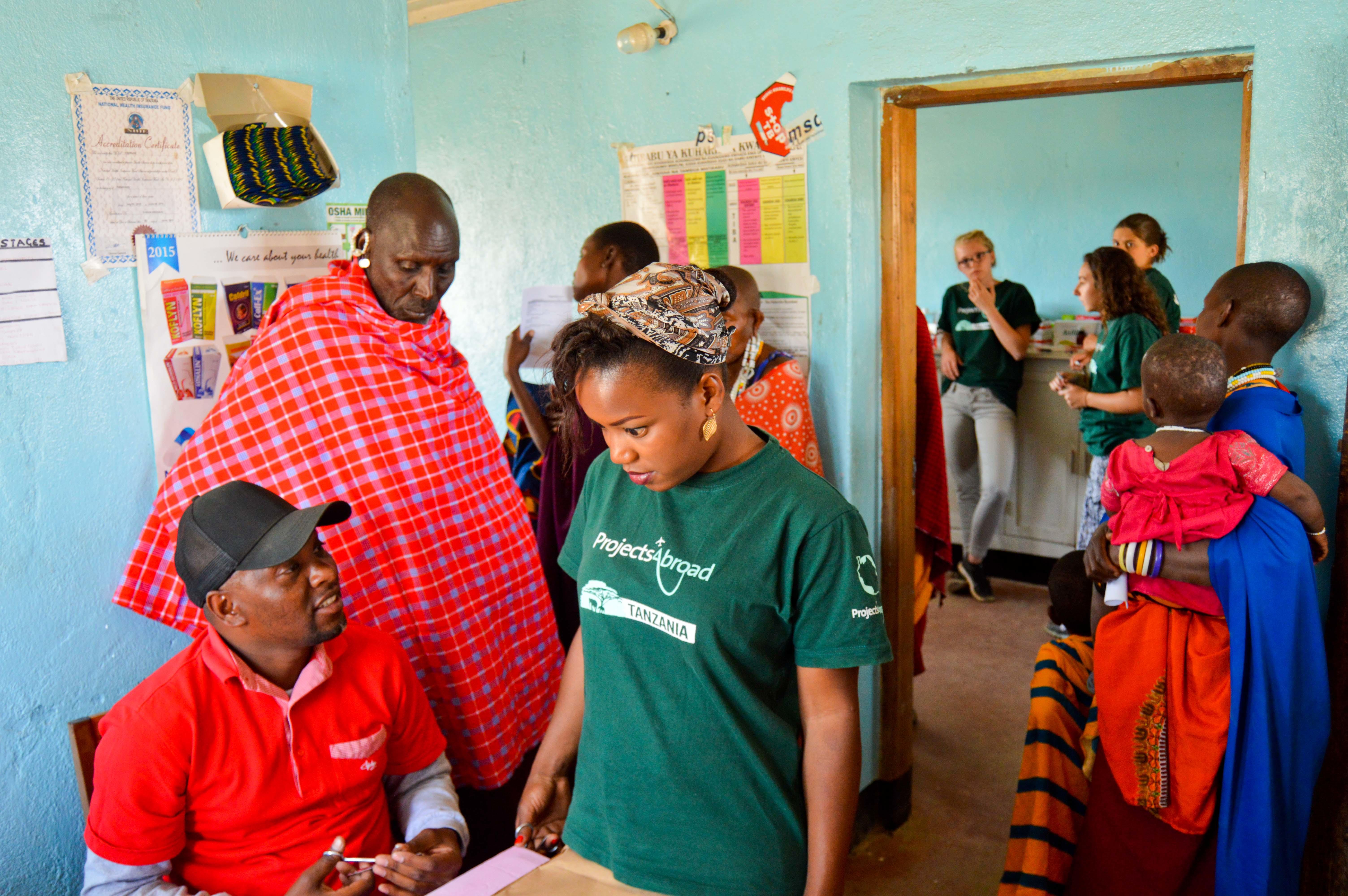Interns from Projects Abroad having a quick chat at a medical outreach during their nursing internship in Tanzania. Two Projects Abroad interns on a nursing internship in Tanzania have a quick chat at a medical outreach.